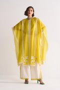 Woman wearing a yellow and white traditional outfit with a white background
