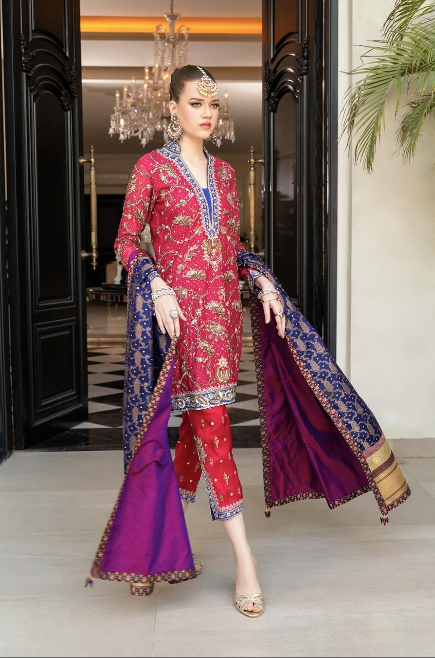 gorgeous WOMEN WEARING TRADITIONAL_raspberry_pink_and_indigo_outfit_handworked_to_perfection_in_a_timeless_fashio_