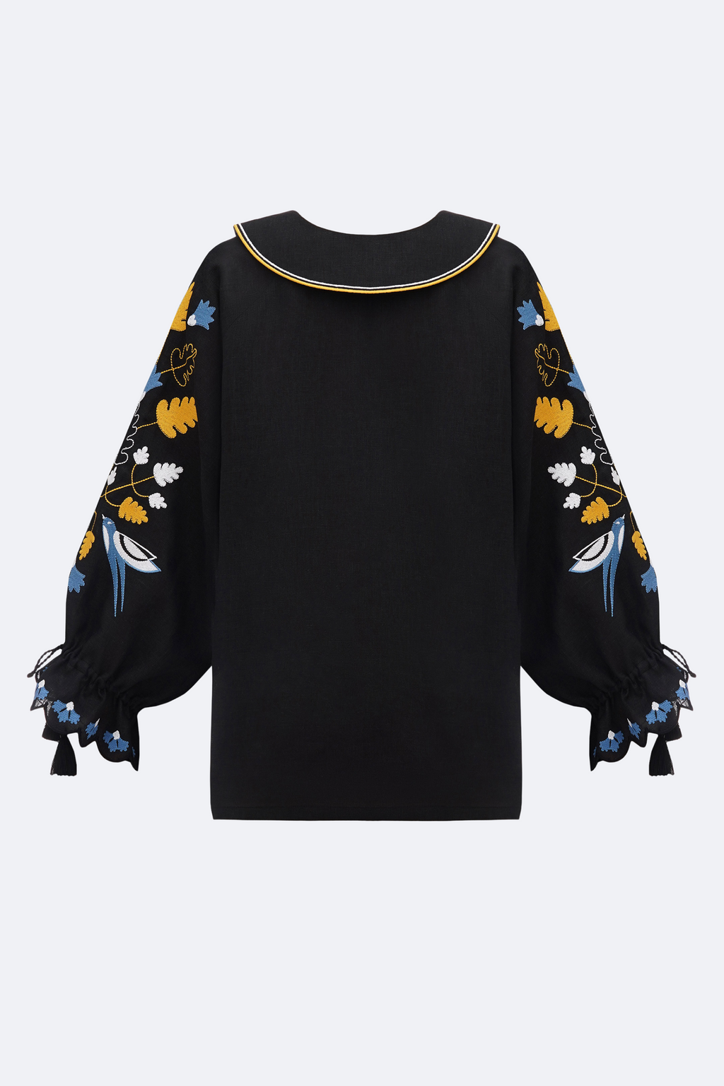 Black blouse with colorful floral patterns on sleeves against a white background