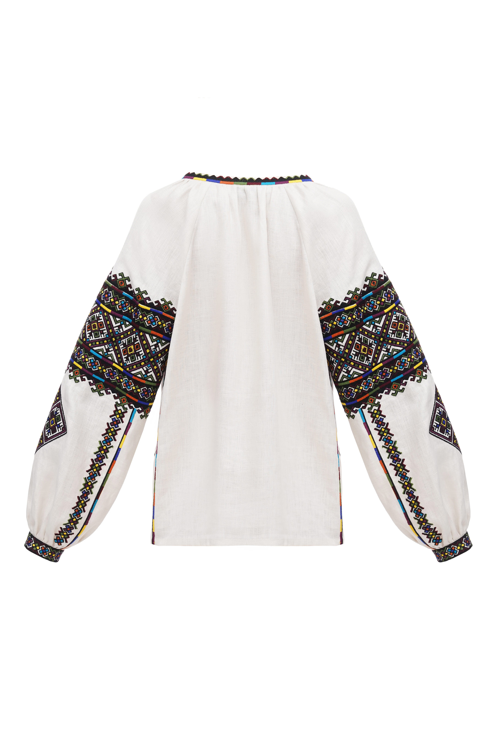 White blouse with colorful geometric patterns on long sleeves against a white background