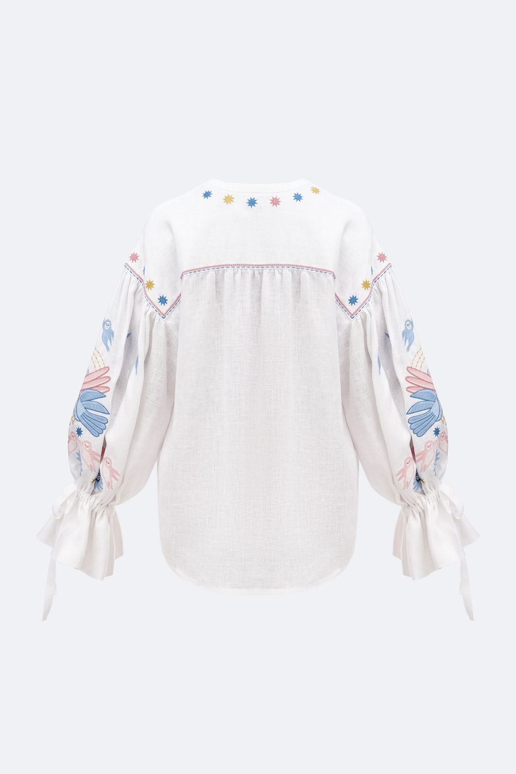 White blouse with colorful sleeve designs on a white background